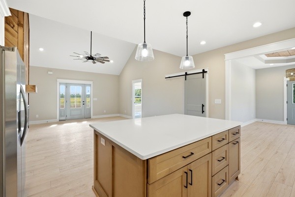 1180 Belfast Farmington Road Lewisburg, TN 37091 - Photo 21 of 41 a view of a kitchen island a sink a refrigerator a window and wooden floor