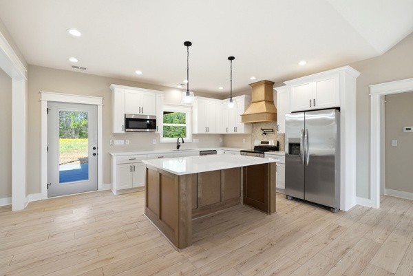 1180 Belfast Farmington Road Lewisburg, TN 37091 - Photo 24 of 41 a kitchen with stainless steel appliances granite countertop a refrigerator a sink a stove and a wooden floors