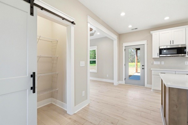 1180 Belfast Farmington Road Lewisburg, TN 37091 - Photo 26 of 41 a view of a kitchen with a refrigerator and a stove top oven