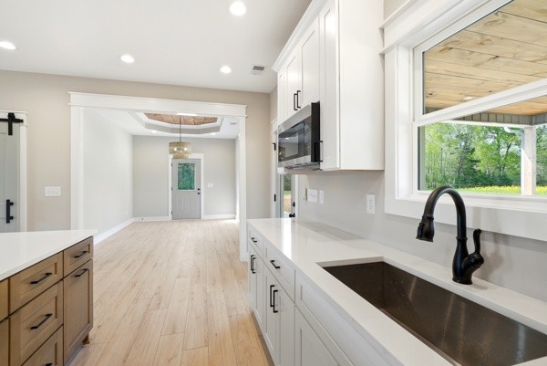 1180 Belfast Farmington Road Lewisburg, TN 37091 - Photo 28 of 41 a kitchen with a sink a counter top space stainless steel appliances a window and a sink