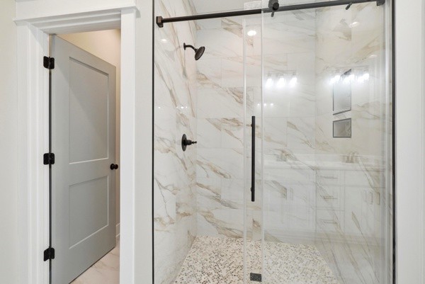 1180 Belfast Farmington Road Lewisburg, TN 37091 - Photo 30 of 41 a bathroom with a glass shower door