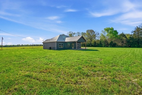 1180 Belfast Farmington Road Lewisburg, TN 37091 - Photo 7 of 41 a backyard of a house with lots of green space and mountain view in back
