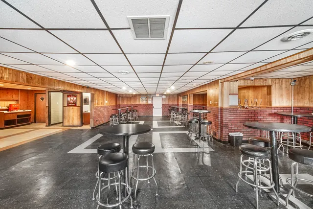 a kitchen with a table and chairs in it