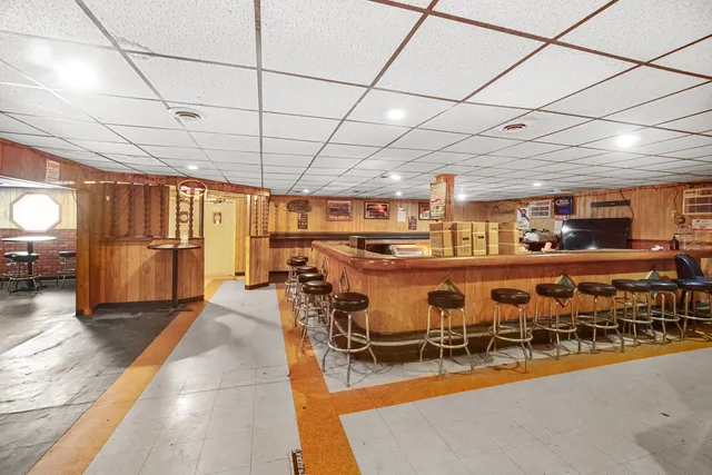 a view of a dining room with furniture wooden floor and chandelier
