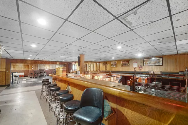 a kitchen with stove and cabinets