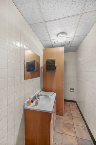 a bathroom with a toilet sink and shower