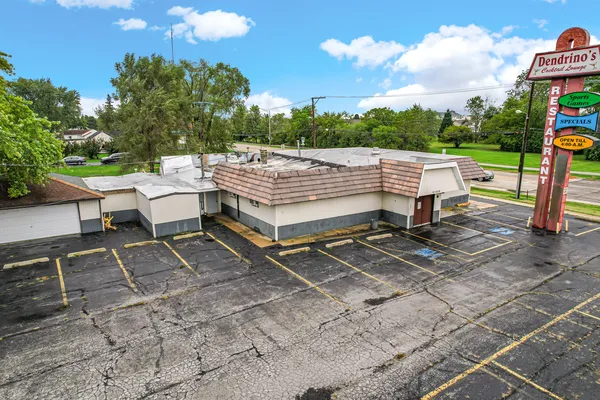a view of a backyard with sitting area
