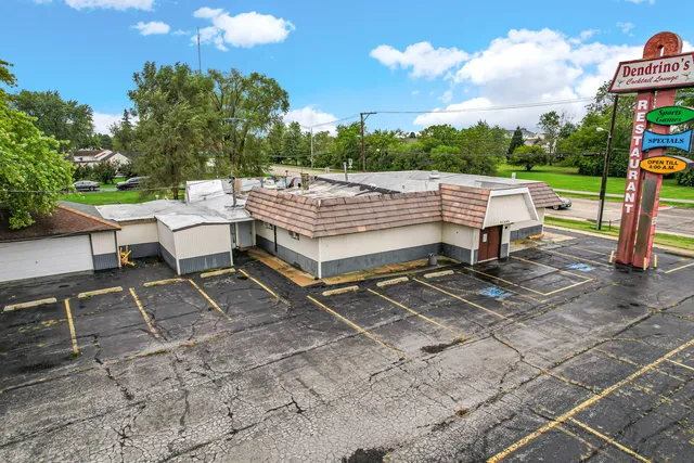a view of a backyard with sitting area
