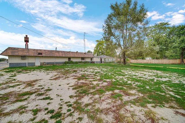 a view of a garden with a house