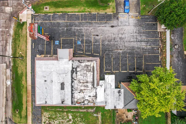 a room with lots of table and chairs