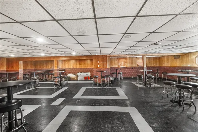 a view of a patio with table and chairs