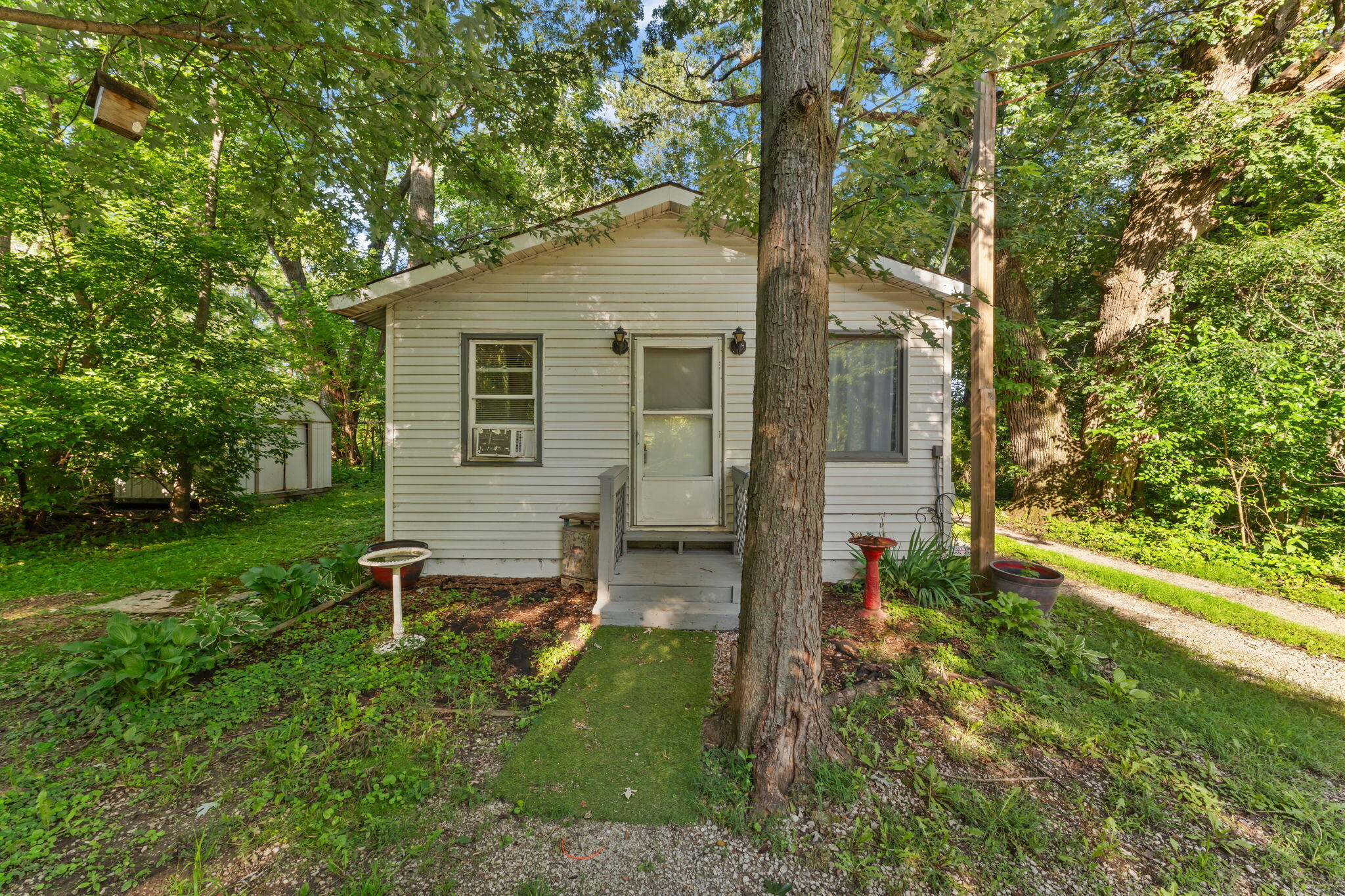 1910 South Calhoun Street Griffith, IN 46319 - Photo 2 of 34 a backyard of a house with table and chairs
