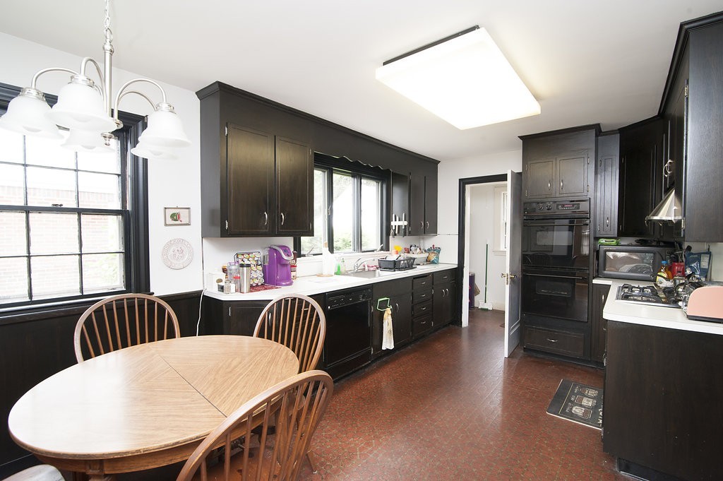 3 Rangeley Road Newton, MA 02465 - Photo 11 of 20 a large kitchen with a table and chairs