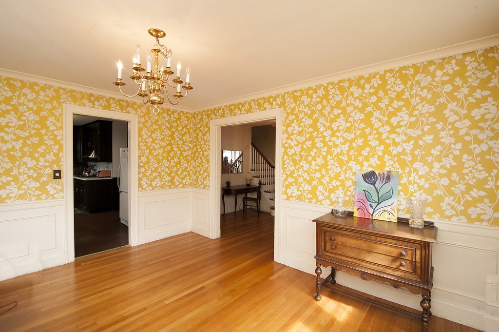 3 Rangeley Road Newton, MA 02465 - Photo 9 of 20 a view of a livingroom with wooden floor and a chandelier