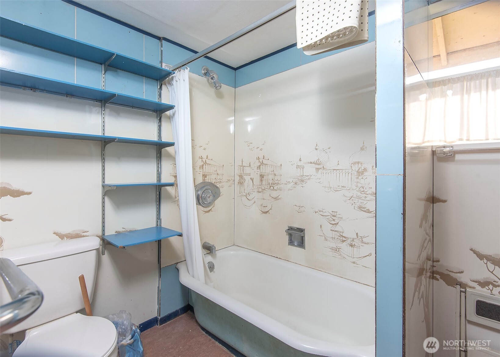 705 South 208th Street Des Moines, WA 98198 - Photo 19 of 20 a bathroom with a toilet and a bathtub