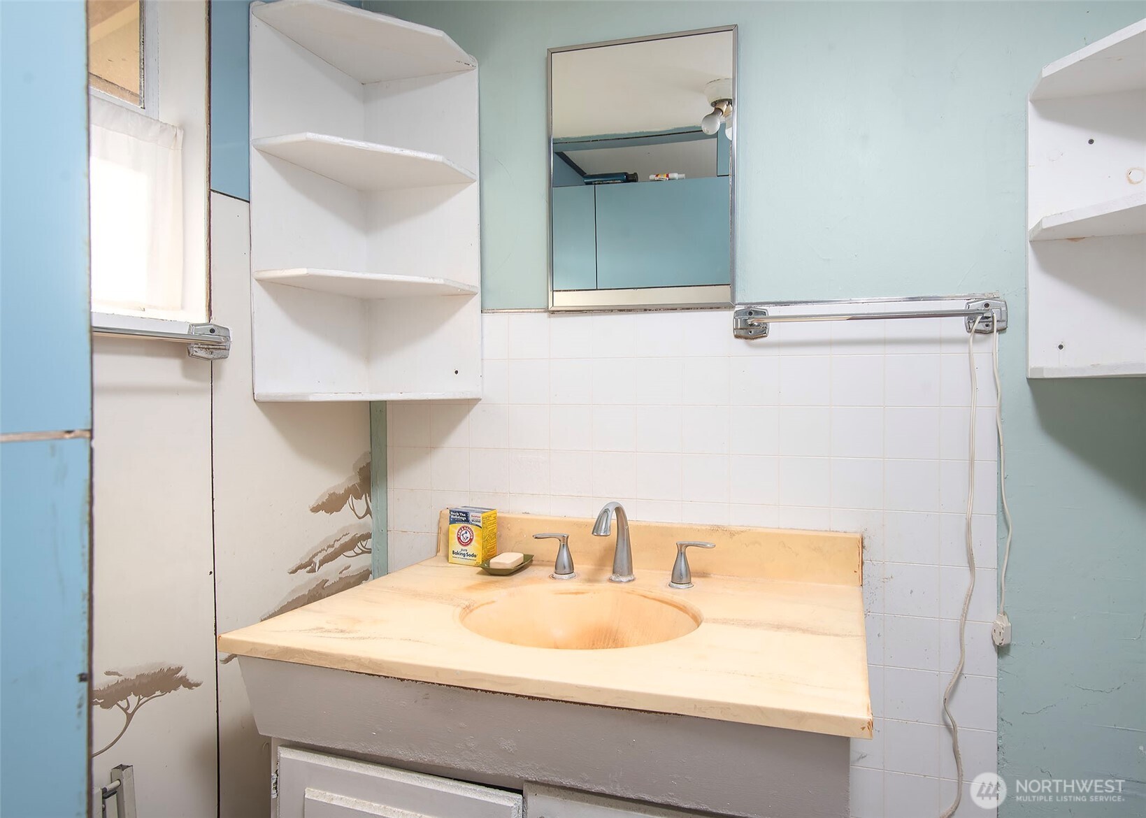 705 South 208th Street Des Moines, WA 98198 - Photo 20 of 20 a bathroom with a sink and a mirror