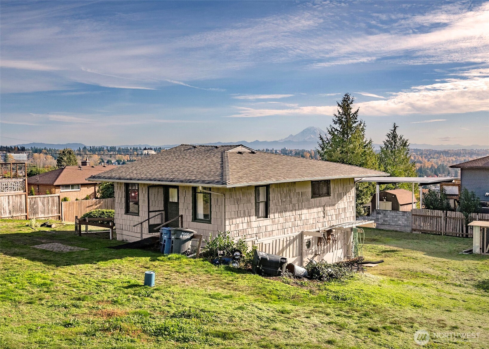 705 South 208th Street Des Moines, WA 98198 - Photo 7 of 20 a front view of a house with swimming pool garden and patio