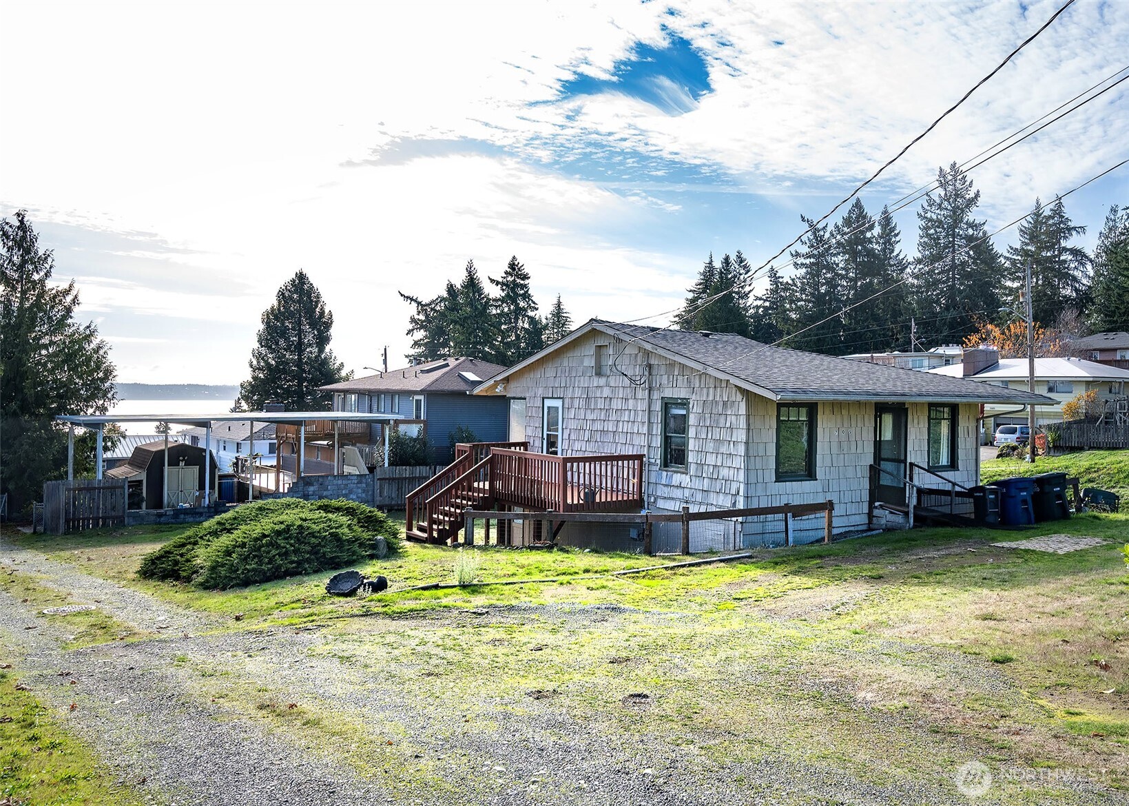 705 South 208th Street Des Moines, WA 98198 - Photo 9 of 20 a view of a house with backyard and sitting area