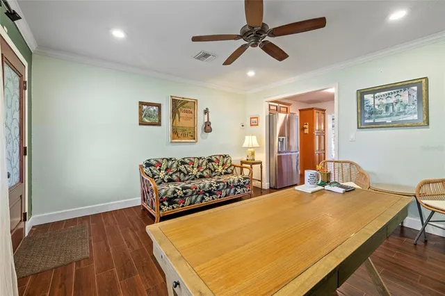 a kitchen with stainless steel appliances granite countertop wooden cabinets a sink and dishwasher with wooden floor