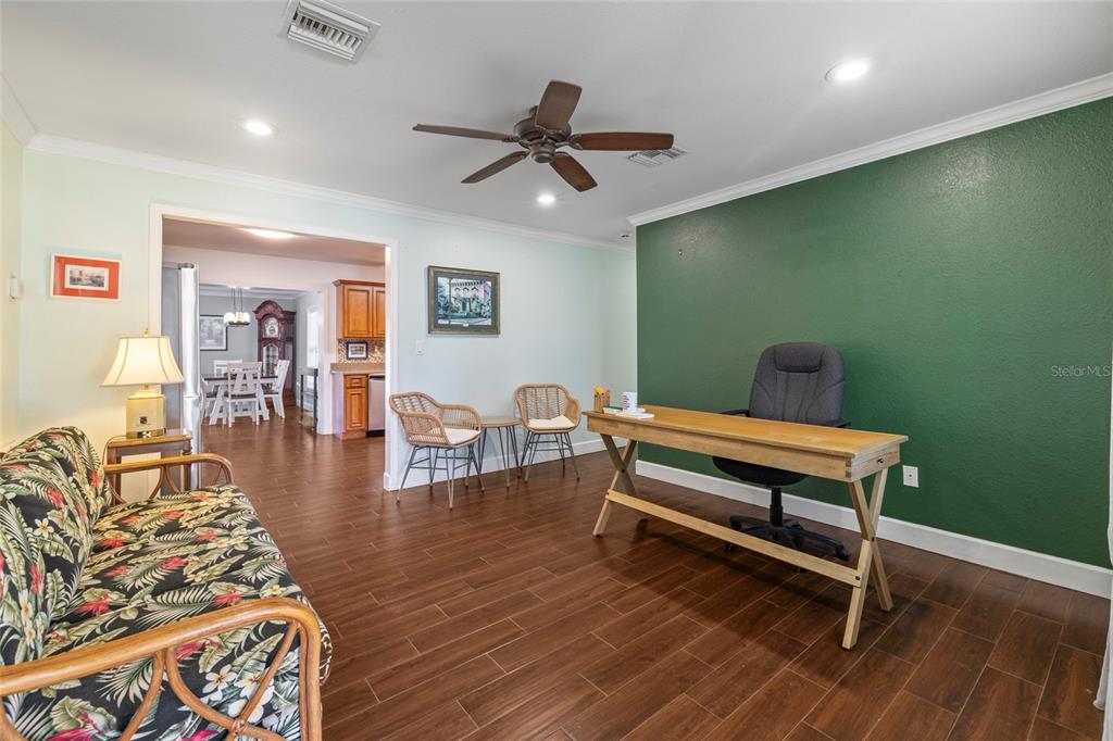 5031 Lakewood Road Sebring, FL 33875 - Photo 12 of 77 a living room with furniture and a wooden floor