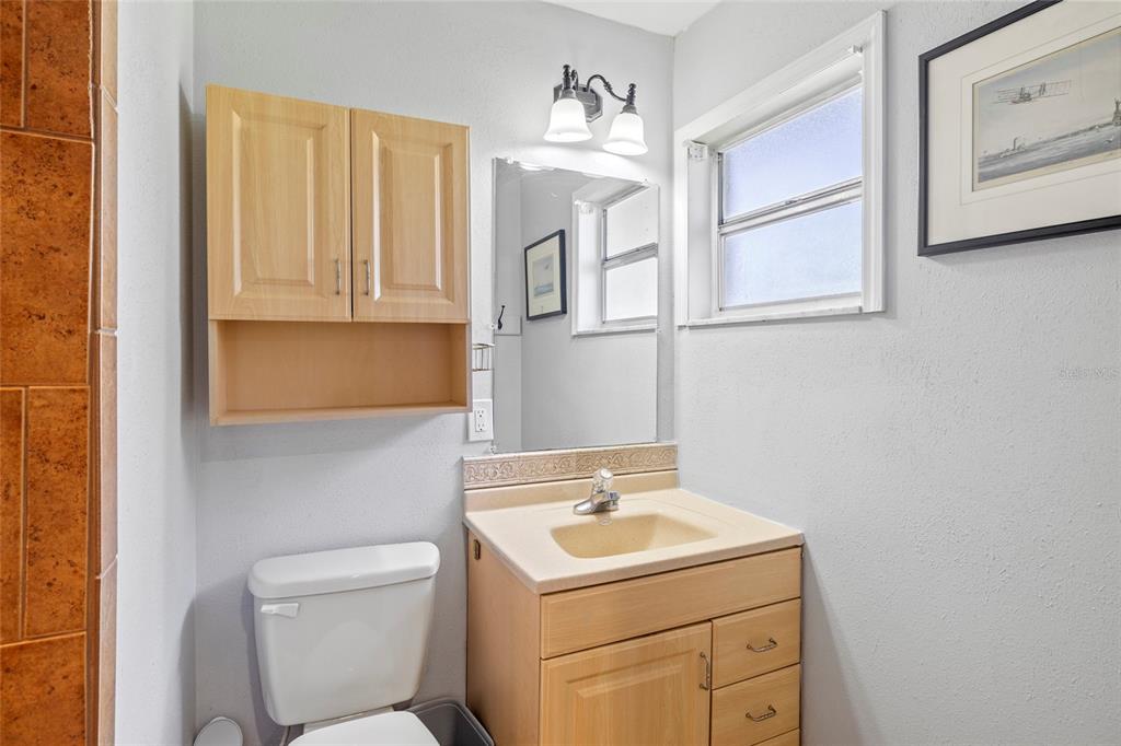 5031 Lakewood Road Sebring, FL 33875 - Photo 24 of 77 a bathroom with a sink a toilet and a mirror