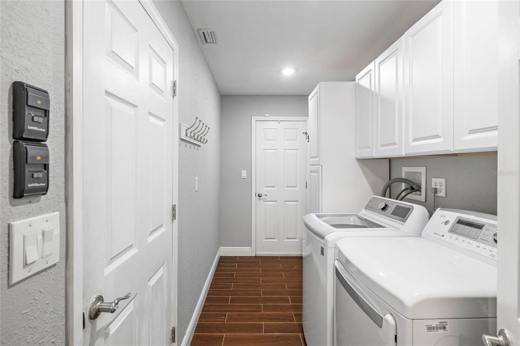 5031 Lakewood Road Sebring, FL 33875 - Photo 32 of 77 a kitchen with a sink a stove and refrigerator