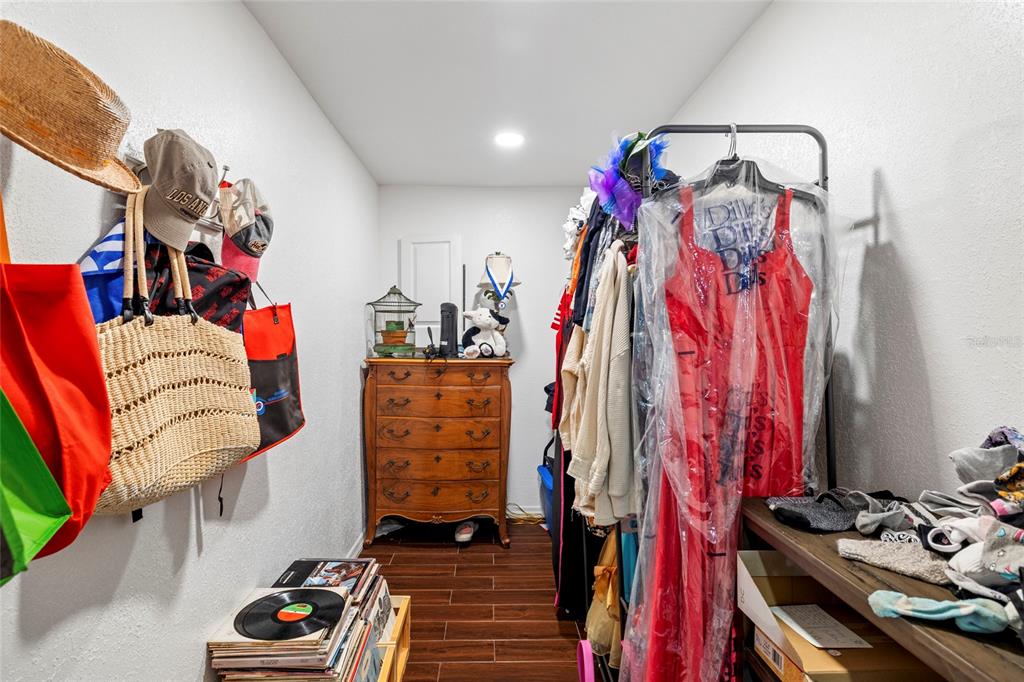 5031 Lakewood Road Sebring, FL 33875 - Photo 34 of 77 a view of walk in closet with clothes and shoes