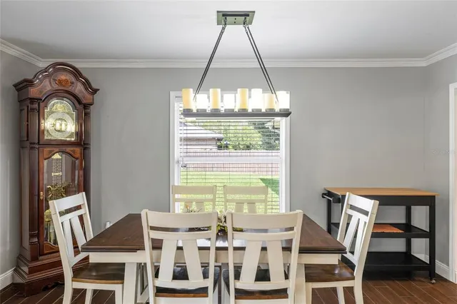 a view of a swimming pool with a patio and a yard