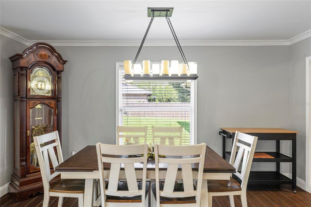 5031 Lakewood Road Sebring, FL 33875 - Photo 36 of 77 a view of a dining room with furniture window and outside view