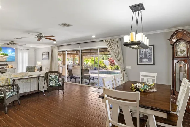 a view of a house with a swimming pool and sitting area