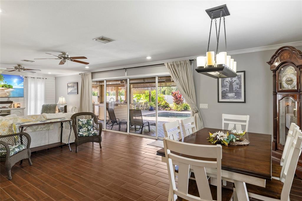 5031 Lakewood Road Sebring, FL 33875 - Photo 37 of 77 a view of a dining room with furniture window and wooden floor