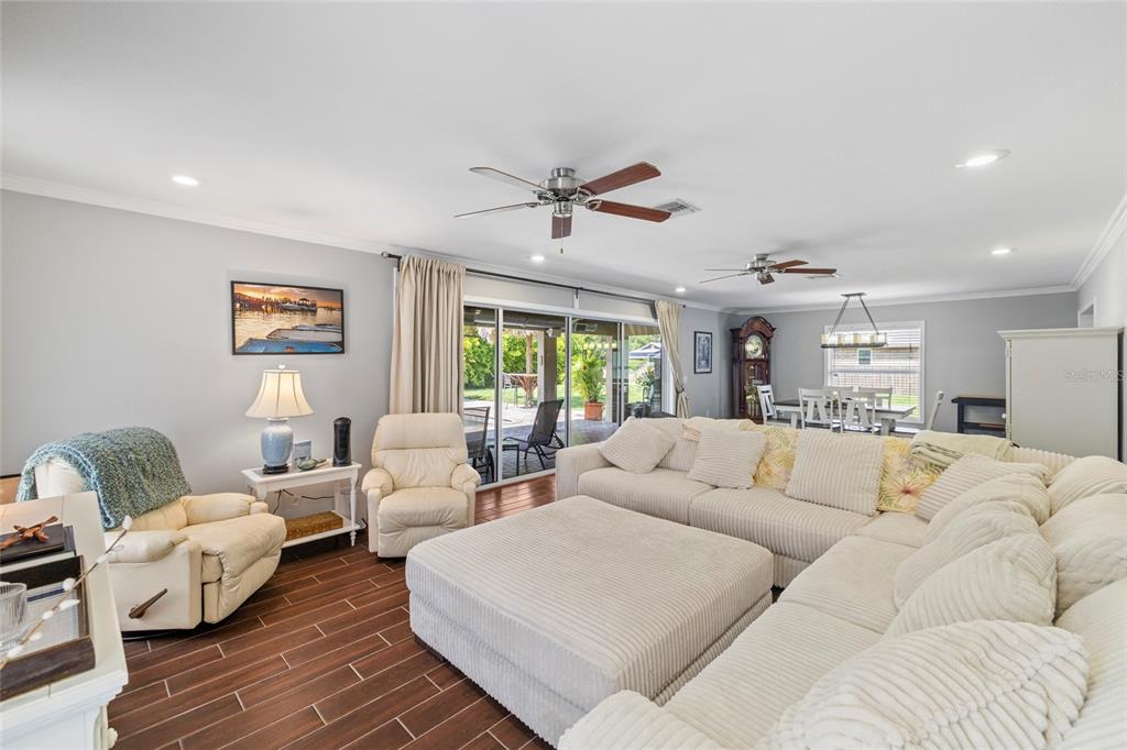 5031 Lakewood Road Sebring, FL 33875 - Photo 40 of 77 a living room with furniture ceiling fan and a rug