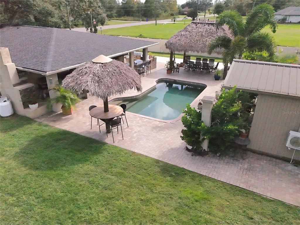 5031 Lakewood Road Sebring, FL 33875 - Photo 4 of 77 an aerial view of a house with garden space and a patio
