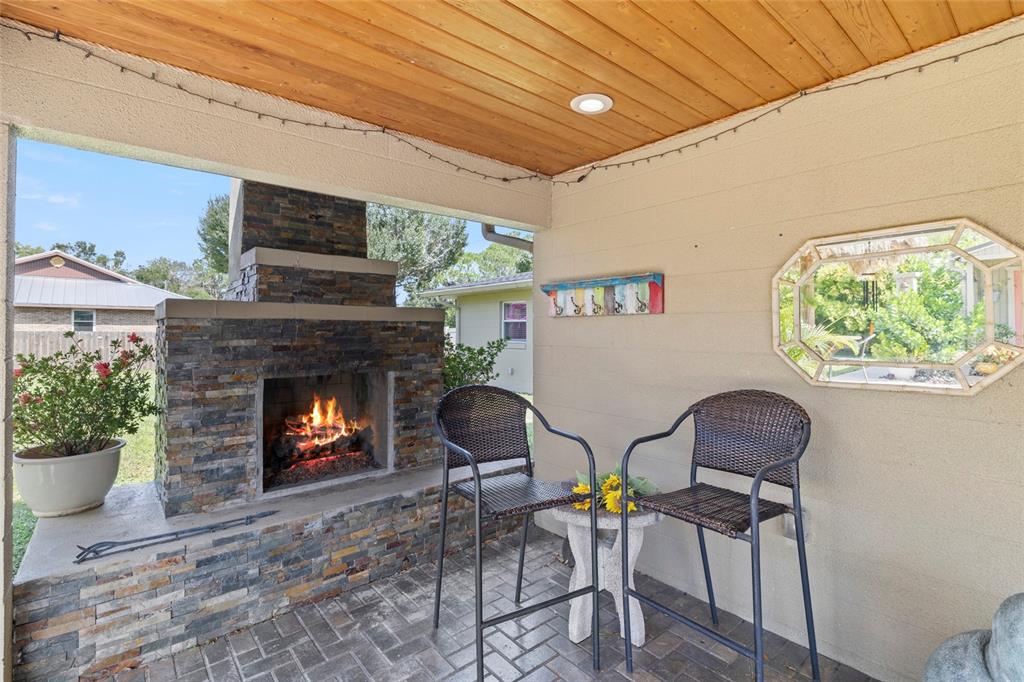 5031 Lakewood Road Sebring, FL 33875 - Photo 43 of 77 a living room with furniture and a fireplace