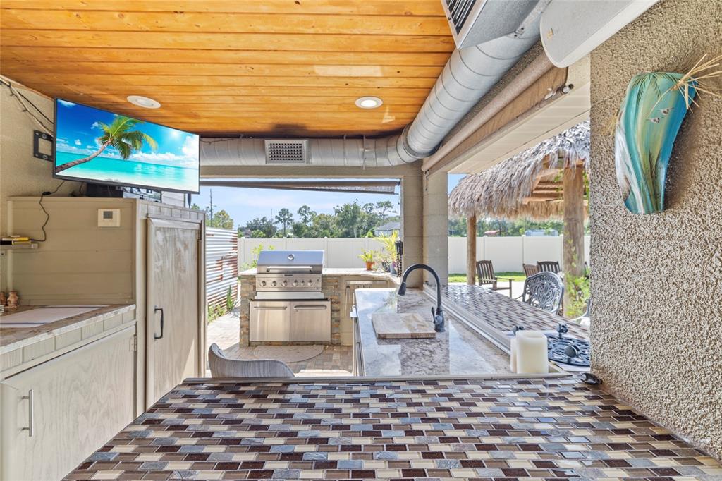 5031 Lakewood Road Sebring, FL 33875 - Photo 46 of 77 a kitchen with stainless steel appliances a stove a refrigerator and a window