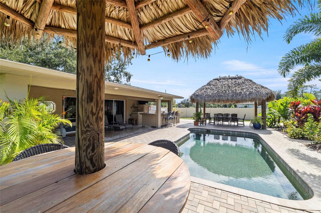 5031 Lakewood Road Sebring, FL 33875 - Photo 55 of 77 a view of a swimming pool with a patio and a yard