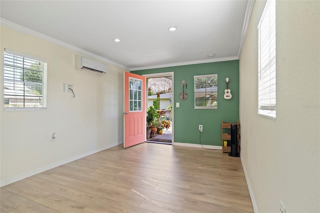 5031 Lakewood Road Sebring, FL 33875 - Photo 60 of 77 wooden floor in an empty room with a window
