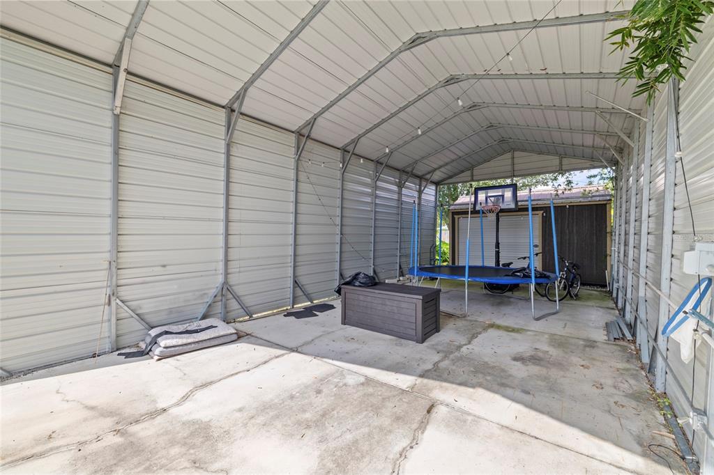 5031 Lakewood Road Sebring, FL 33875 - Photo 64 of 77 a view of a living room with a patio