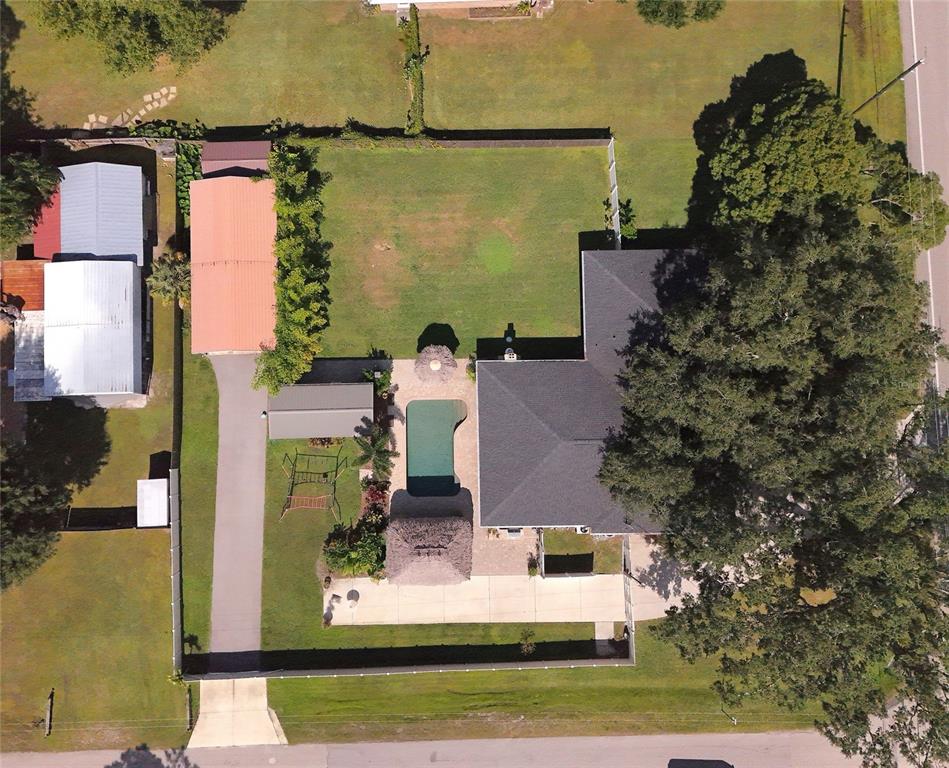 5031 Lakewood Road Sebring, FL 33875 - Photo 66 of 77 an aerial view of a house with a yard basket ball court and outdoor seating