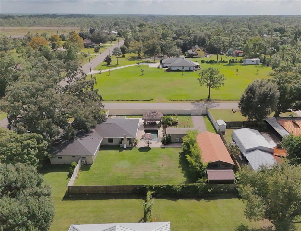 5031 Lakewood Road Sebring, FL 33875 - Photo 77 of 77 an aerial view of a house with a garden and lake view