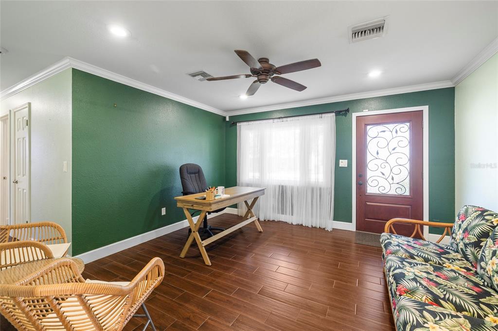 5031 Lakewood Road Sebring, FL 33875 - Photo 10 of 77 a workspace with furniture hardwood and a window