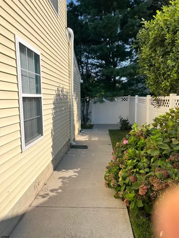 a view of a house with a yard and plants