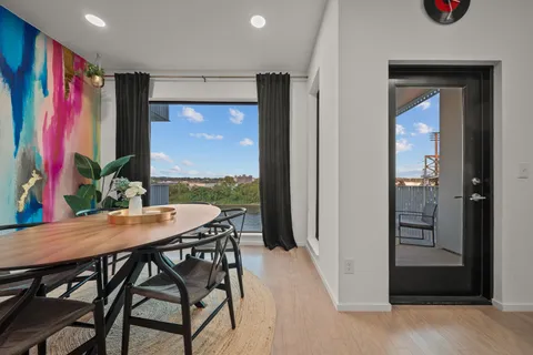 a view of a dining room with furniture window and wooden floor