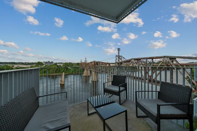 a view of a balcony with furniture