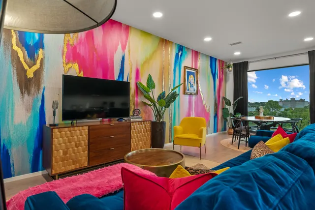 a living room with furniture and a flat screen tv