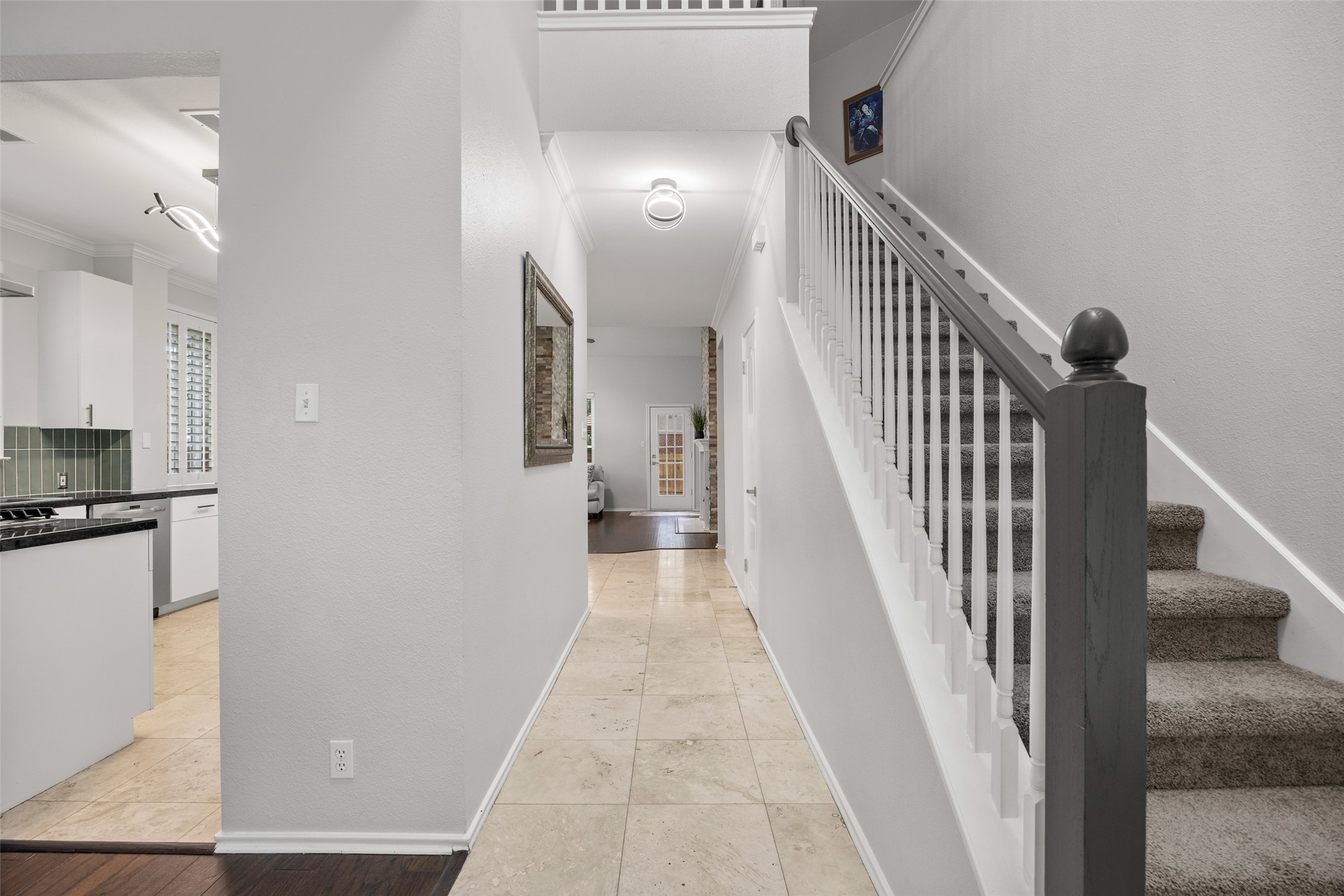 8610 Axis Drive Austin, TX 78749 - Photo 11 of 29 a view of a hallway with wooden floor and staircase