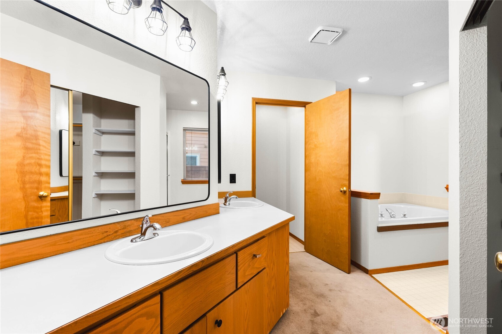 5440 Park Pl Loop Southeast Lacey, WA 98503 - Photo 21 of 36 a bathroom with a sink and a mirror