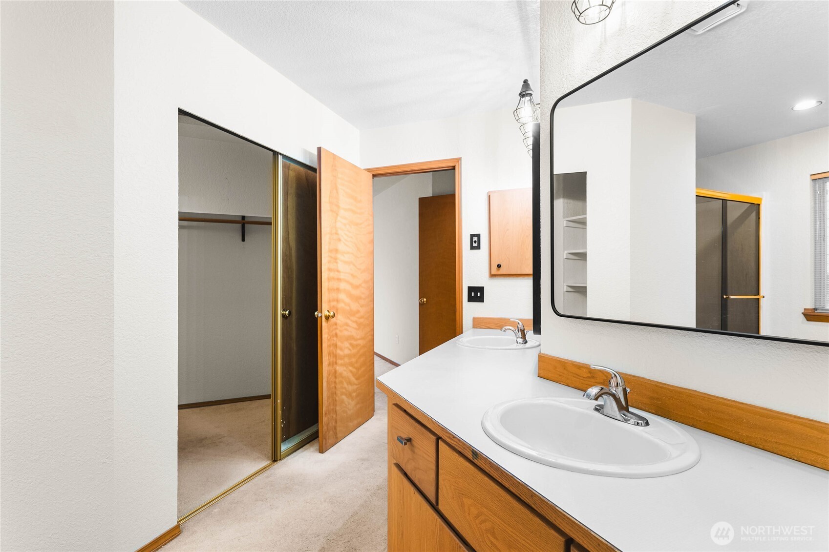 5440 Park Pl Loop Southeast Lacey, WA 98503 - Photo 24 of 36 a bathroom with a sink and a mirror