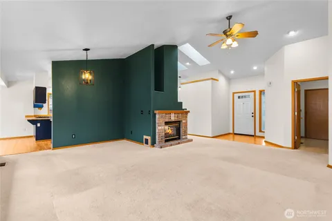 a view of an empty room with a mirror