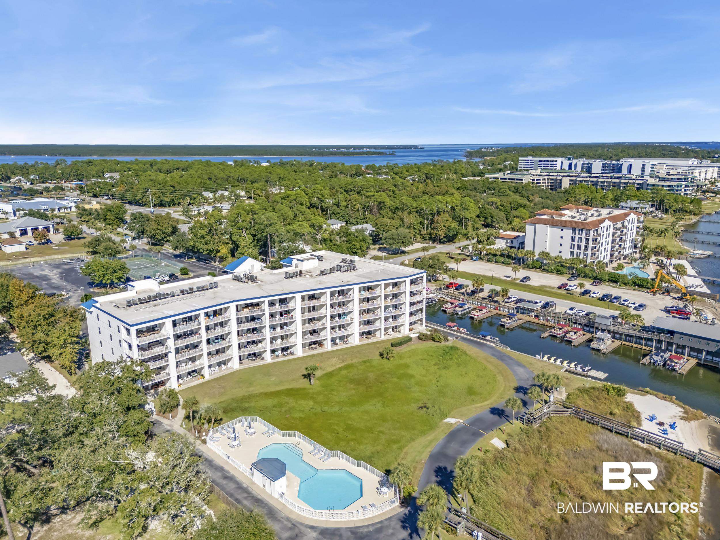 27282 Canal Road, Unit 104 Orange Beach, AL 36561 - Photo 42 of 79 Bird's eye view of apartment complex and a nearby body of water